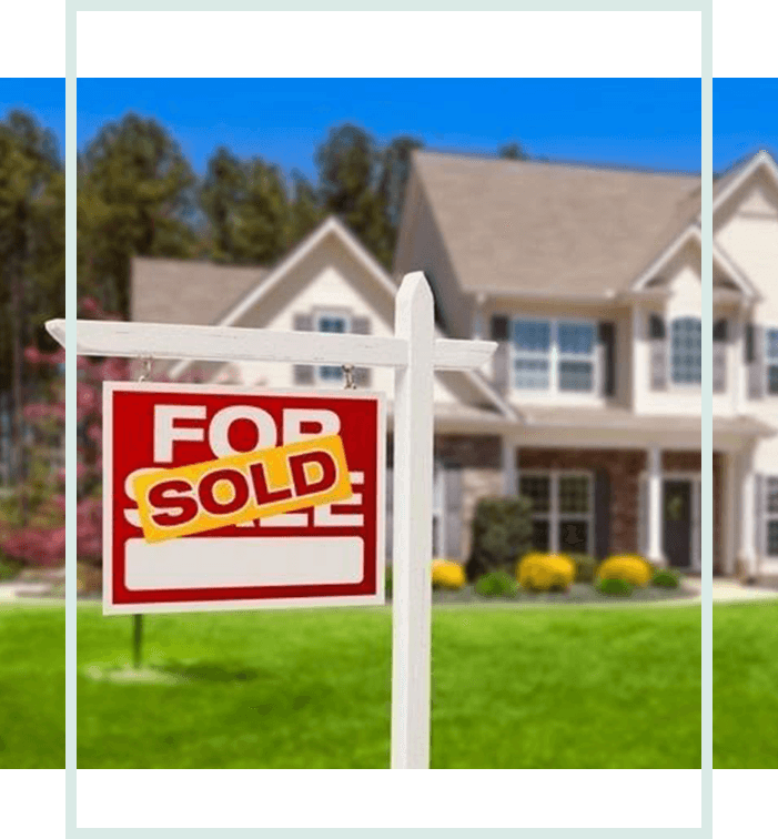 A house with a for sale sign in front of it