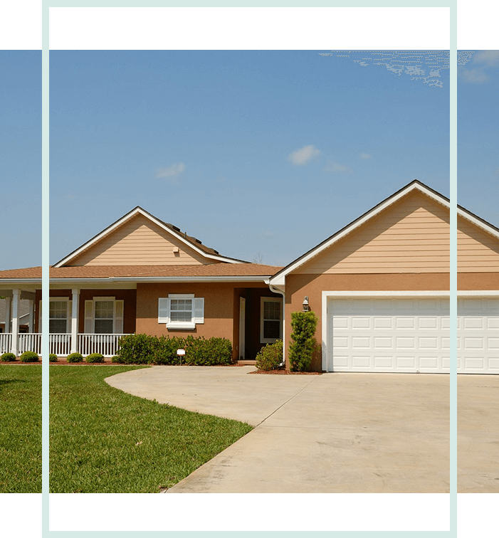 A house with grass and trees in front of it